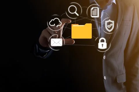 Document Management System DMS .Businessman hold folder and document icon.Sof Stock Photos
