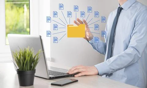 Document Management System DMS .Businessman hold folder and document icon.Sof Foto stock