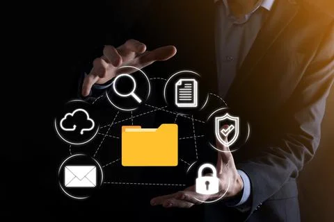 Document Management System DMS .Businessman hold folder and document icon.Sof 写真素材