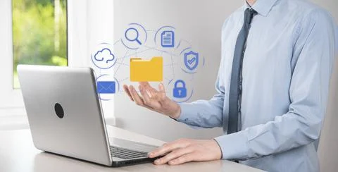 Document Management System DMS .Businessman hold folder and document icon.Sof 写真素材