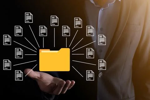 Document Management System DMS .Businessman hold folder and document icon.Sof 库存照片