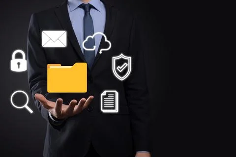 Document Management System DMS .Businessman hold folder and document icon.Sof 写真素材