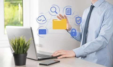 Document Management System DMS .Businessman hold folder and document icon.Sof Stockfoto's