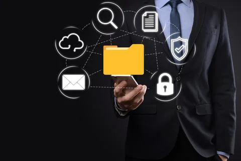 Document Management System DMS .Businessman hold folder and document icon.Sof 写真素材