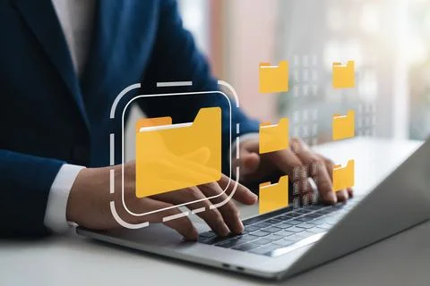 Document management system, DMS, company employees manage folders via lapto.. Stock Photos