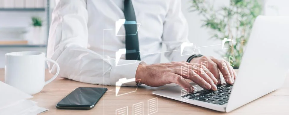 Document Management System (DMS) setup by businessman working on laptop compu Fotos de archivo