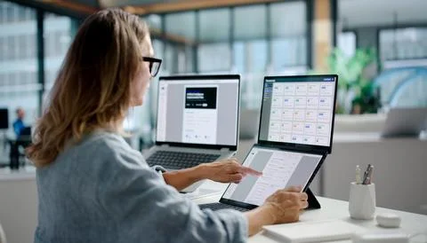 Document Manager Reviews Files On Dual Touchscreen Laptops For Secure Workflo Stock Photos