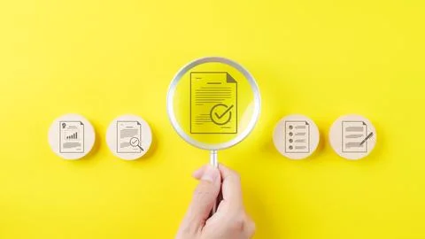 Document quality control concept. Magnifying glass focus on correct sign ma.. Stock Photos