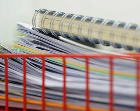 Document in red basket at office Stock Photos