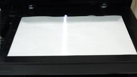 Document scanning process. Scanner in operation scans a sheet of paper with the Stock Footage 146318876