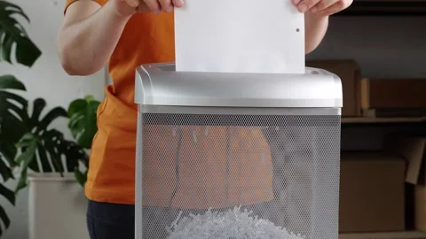 Document Shredding. Paper shredder to destroy private, confidential, or Stock Footage 243538630