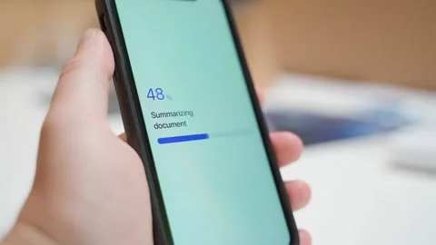 Document summarizing stuck at seventy percent on smartphone screen. Frozen Stock Footage 342735354