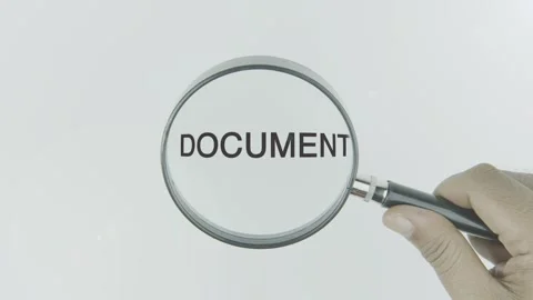 Document text or word highlighted by a magnifying glass in a hand on a white Stock Footage 303614823