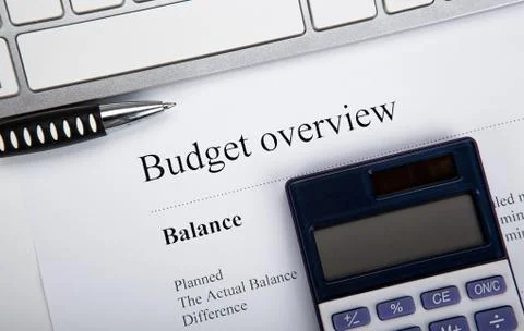 Document with title budget overview on the desktop Stock Photos