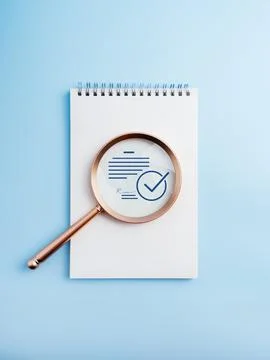 Document verification concept with magnifying glass focusing on contract pa.. Stock Photos