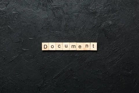 Document word written on wood block. Document text on cement table for your d Stock Photos