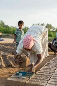 Documentary  hand made bricks in India Stock Photos