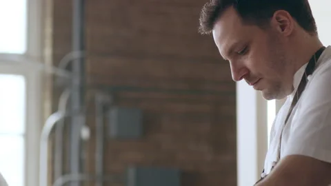 Documentary style Chef's Table shot of culinary artist placing thin slices of po Stock Footage 199463311