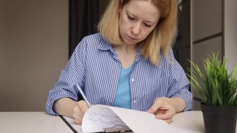 Documentation, a woman writes on forms, corporate paperwork, manager signing Stock Footage 275827626