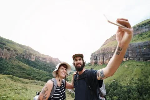 Documenting their adventures together Stock Photos