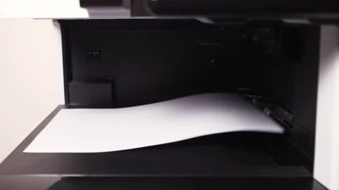 Documents A3 come out of the printer after printing Stock Footage 294976052