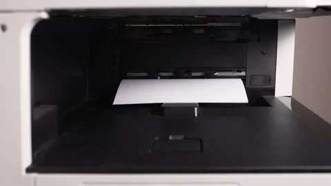 Documents A3 come out of the printer after printing Stock Footage 294976055