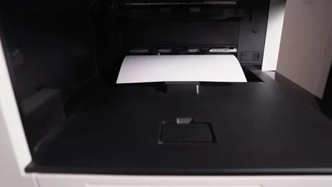 Documents A3 come out of the printer after printing Stock Footage 294976189