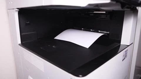 Documents A3 come out of the printer after printing Stock Footage 294976218