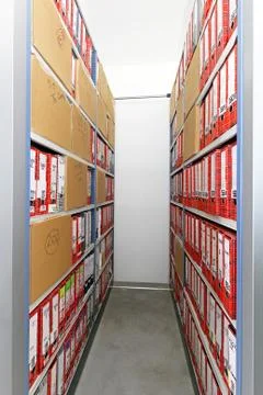 Documents and company papers in ring binders at shelf Stock Photos