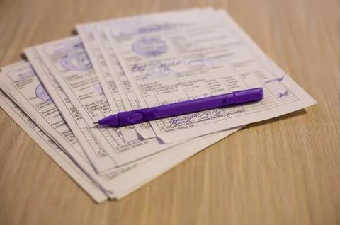 Documents and pen on the table Stock Photos