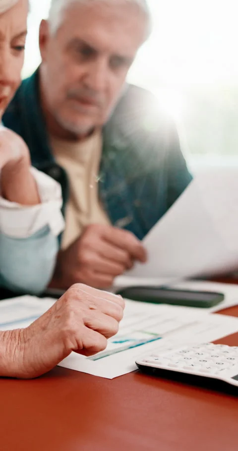 Documents, calculator and hands of senior couple in home with plan for Stock Footage 341489465