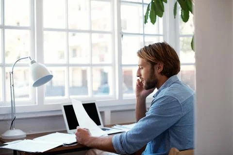 Documents, call and man in home office for business contact, negotiation and Stock Photos