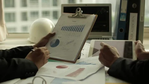 Documents Checked by two businessmen Stock Footage 239020168