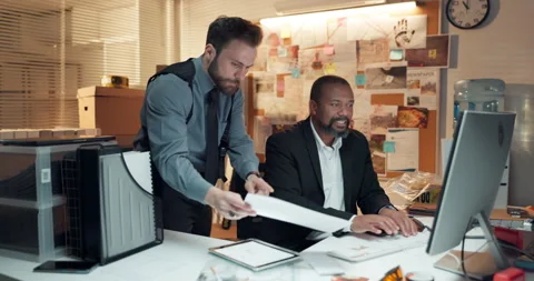 Documents, computer and detectives in office with meeting for solving case in Stock Footage 314885176