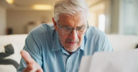 Documents, confused and old man in home with stress, angry or question for Stock Photos