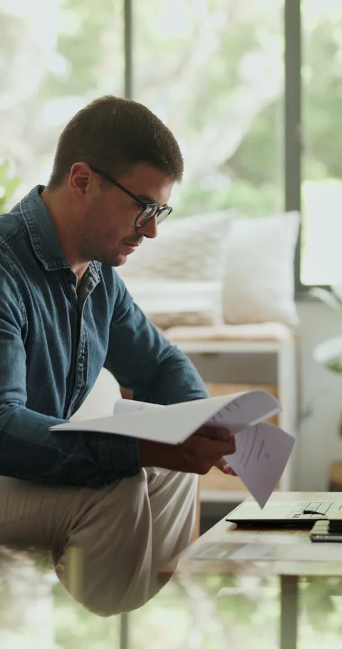 Documents, copywriting and man in home, laptop for online submission and Stock Footage 330910198