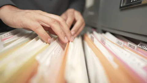 Documents at the filing cabinet Stock Footage 153572193