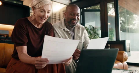 Documents, finance and laughing with interracial couple on sofa in home living Stock Footage 337921972