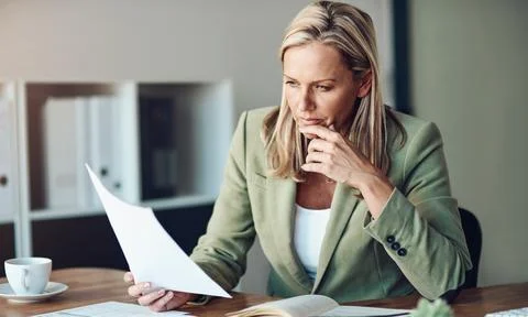 Documents, finance and problem solving with business woman in office for Stock Photos