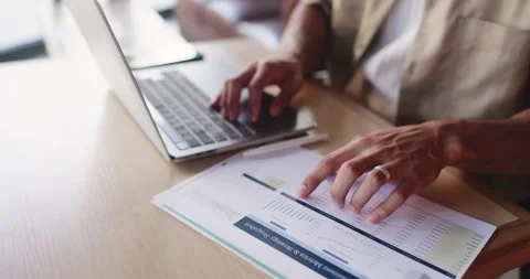 Documents, hands and laptop with man in coffee shop for budget, financial report Stock Footage 330040348
