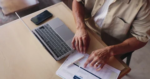 Documents, hands and laptop with person in coffee shop for budget, financial Stock Footage 330081278