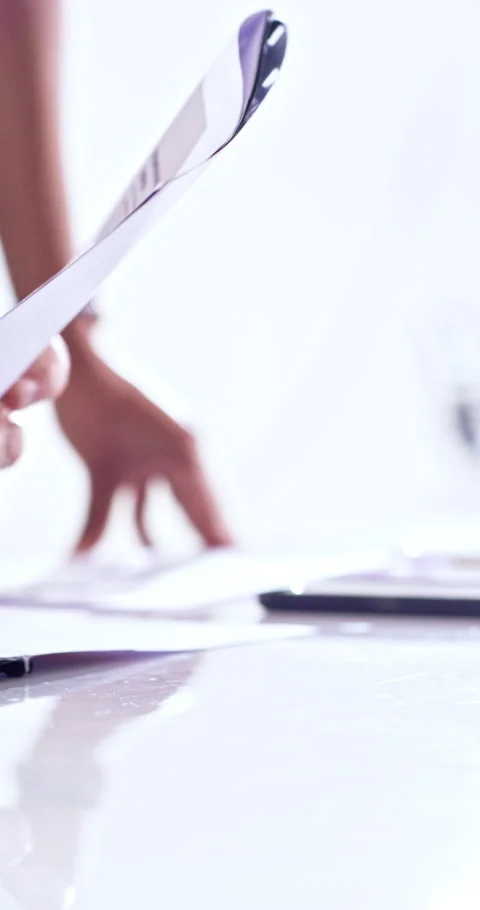 Documents, hands and reading with business people in boardroom together for Stock Footage 336701052