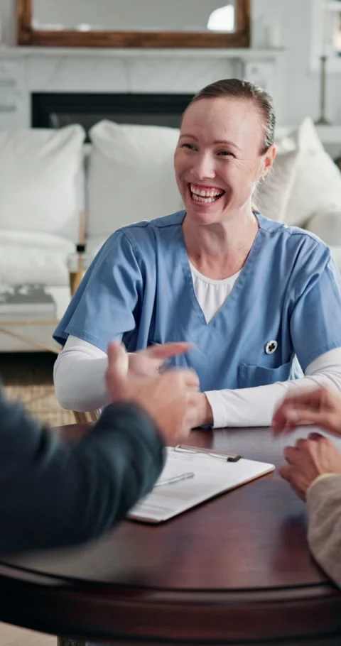Documents, handshake and signature of old couple with nurse for insurance sign 库存影片 338427100
