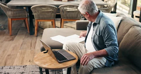 Documents, laptop and fail with old man on sofa for mortgage debt, retirement Stock Footage 326449494