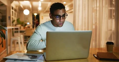 Documents, laptop and web designer with business man in office at night for work Stock Photos