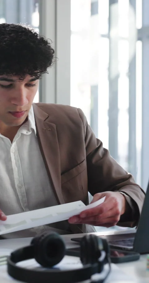 Documents, laptop or typing with man in office to review platform engagement on Stock Footage 332990721