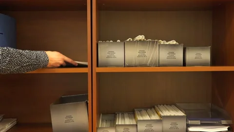 Documents neatly folded on a shelf Stock Footage 111172042
