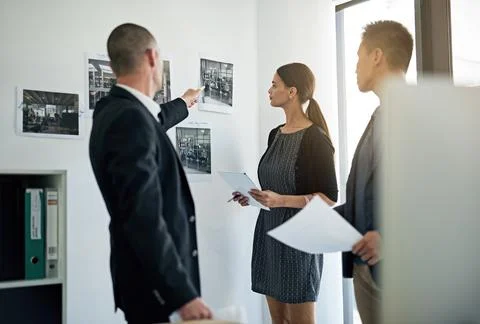 Documents, problem solving and business people in meeting with interior design Stock Photos