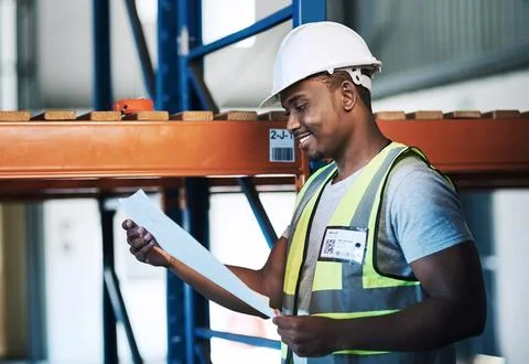 Documents, reading and black man in factory, supply chain or schedule for Foto stock