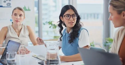 Documents, talking and teamwork with business women in boardroom together for Stock-Fotos